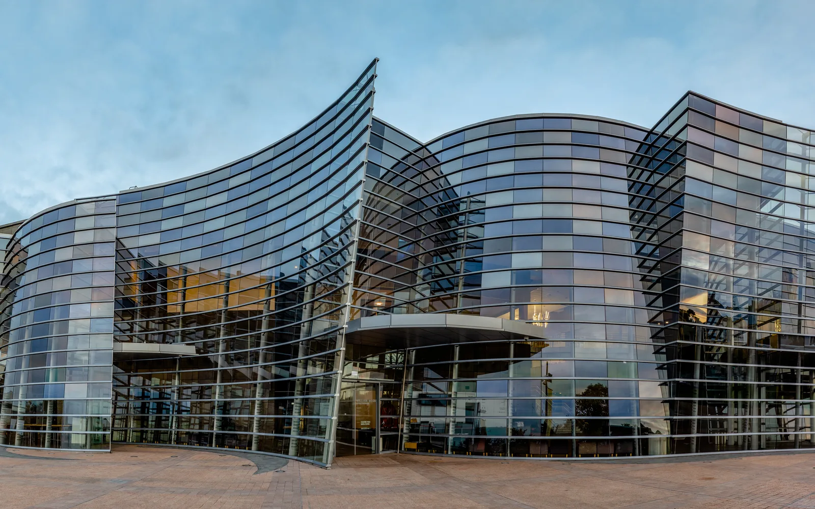 The modern exterior of Christchurch Art Gallery with glass windows and contemporary architecture